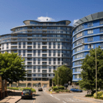 Street view of Centrium apartment complex with curved modern architecture, Woking