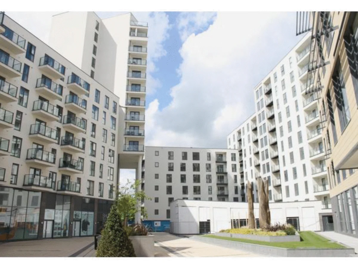Apartment building courtyard with landscaped greenery and modern flats at Cardinal Place, Woking