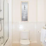 Bright bathroom with walk-in shower, toilet, and sink at The Elm Suite, Kings Road, Reading