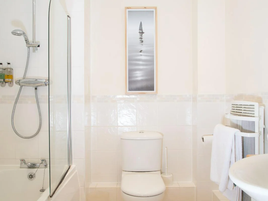 Bright bathroom with walk-in shower, toilet, and sink at The Elm Suite, Kings Road, Reading