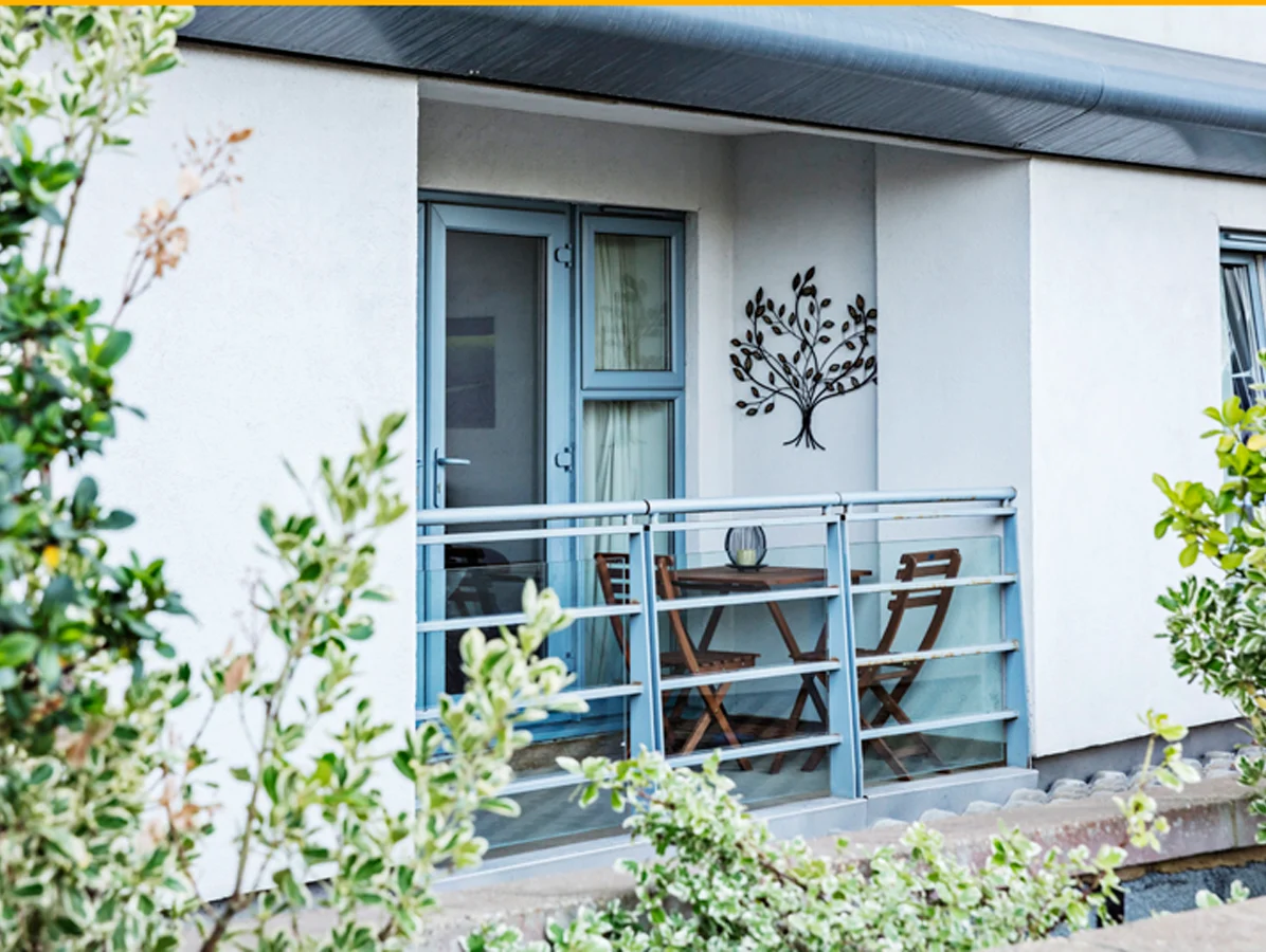 Modern apartment building exterior with balcony and garden view, Centrium, Woking