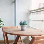 Private balcony with potted plants and wooden table at The Elm Suite, Kings Road, Reading